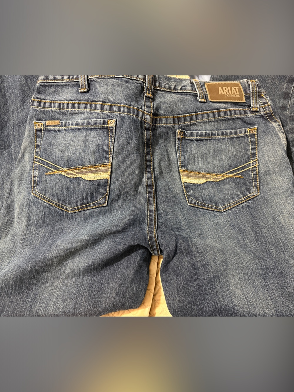 Ariat Men's Relaxed Fit Denim Jeans in Faded Blue with Tan Stitching